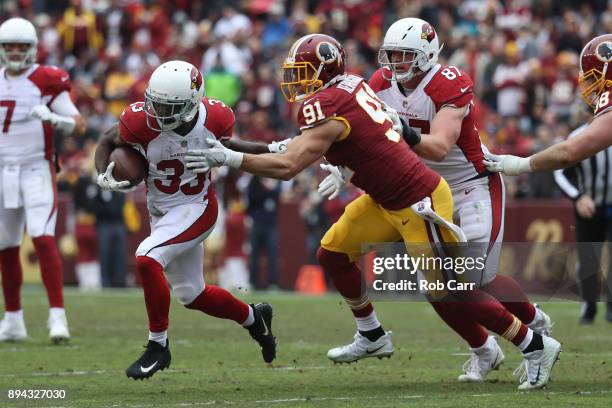 Running back Kerwynn Williams of the Arizona Cardinals carries the ball in the second quarter against the Washington Redskins at FedEx Field on...