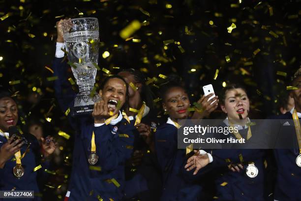 Allison Pineau of France celebrate with the trophy after the IHF Women's Handball World Championship final match between France and Norway at...