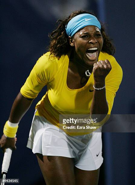 Serena Williams celebrates winning match point in the second set tie-break over Na Li of China at the Bank of the West Classic Day Two at Stanford...