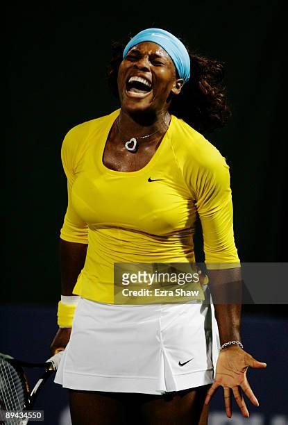 Serena Williams reacts to losing a point in the second set tie break against Na Li of China at the Bank of the West Classic Day Two at Stanford...