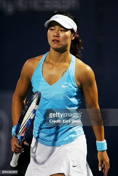 Na Li of China walks on the court before being defeated by Serena Williams in a second set tie break during the Bank of the West Classic Day Two at...