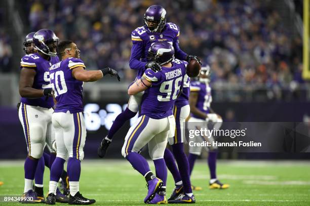 Terence Newman of the Minnesota Vikings celebrates with teammate Brian Robison after intercepting the ball in the third quarter of the game against...