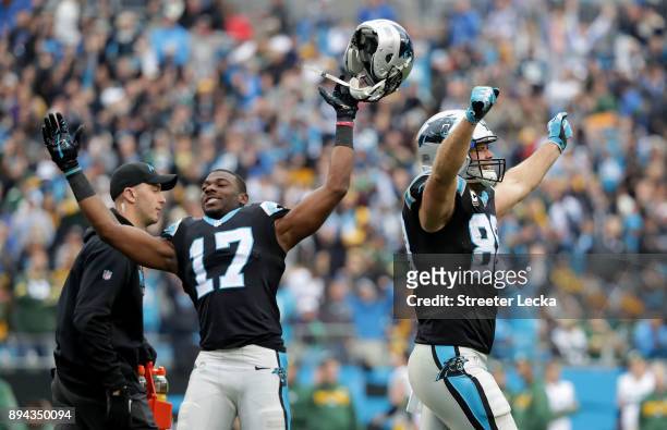 Devin Funchess and teammate Greg Olsen of the Carolina Panthers react after a touchdown against the Green Bay Packers in the third quarter during...