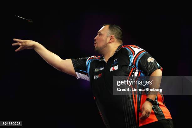 Willard Bruguier of USA in action during his first round match against Cody Harris of New Zealand on day four of the 2018 William Hill PDC World...