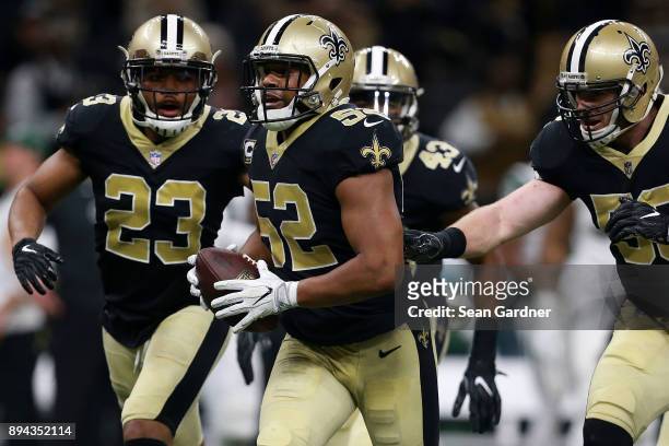 Outside linebacker Craig Robertson of the New Orleans Saints reacts after an interception during the second half of a game against the New York Jets...