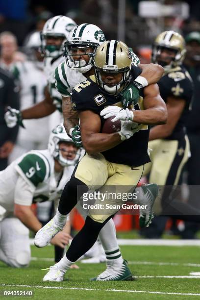 Outside linebacker Craig Robertson of the New Orleans Saints returns an interception during the second half of a game against the New York Jets at...