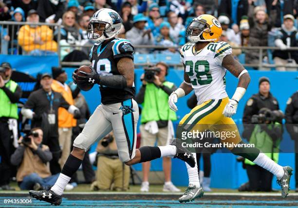 Damiere Byrd of the Carolina Panthers catches a touchdown pass against Josh Hawkins of the Green Bay Packers in the fourth quarter during their game...