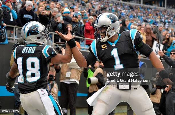 Damiere Byrd celebrates with teammate Cam Newton of the Carolina Panthers after a touchdown against the Green Bay Packers in the fourth quarter...