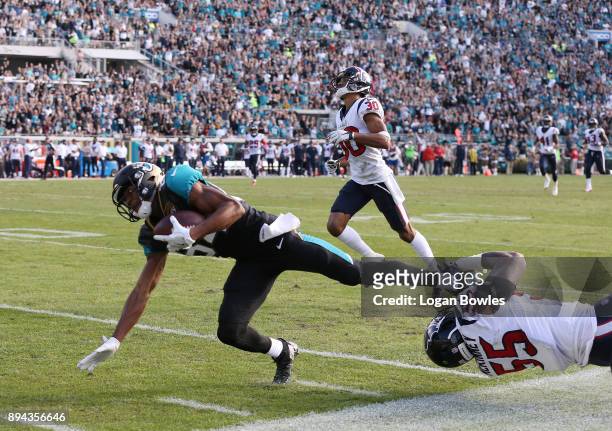 Keelan Cole of the Jacksonville Jaguars runs with the football against Benardrick McKinney of the Houston Texans during the second half of their game...