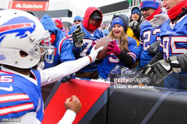 Tyrod Taylor of the Buffalo Bills gives the ball to a young fan after scoring a touchdown during the second quarter against Miami Dolphins on...
