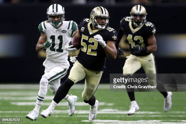 Craig Robertson of the New Orleans Saints returns an interception during the second half of a game against the New York Jets at Mercedes-Benz...