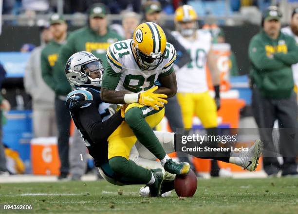 James Bradberry of the Carolina Panthers forces a fumble against Geronimo Allison of the Green Bay Packers in the fourth quarter during their game at...