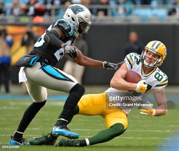 Jordy Nelson of the Green Bay Packers makes a catch against Daryl Worley of the Carolina Panthers during their game at Bank of America Stadium on...