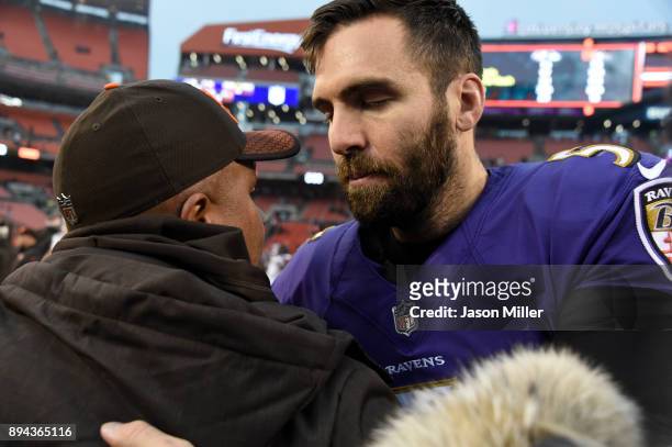 Joe Flacco of the Baltimore Ravens shakes hands with head coach Hue Jackson of the Cleveland Browns after the game. The Baltimore Ravens won 27 to 10...