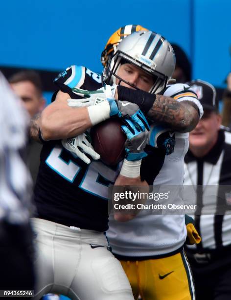 Carolina Panthers running back Christian McCaffrey makes a reception in front of Green Bay Packers strong safety Josh Jones in the first half on...