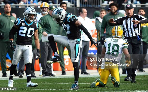 Carolina Panthers cornerback Kevon Seymour, center, celebrates his stop of Green Bay Packers wide receiver Randall Cobb's attempt at catching a pass...