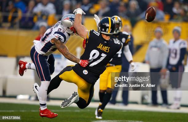 Patrick Chung of the New England Patriots breaks up a pass intended for Jesse James of the Pittsburgh Steelers in the first quarter during the game...