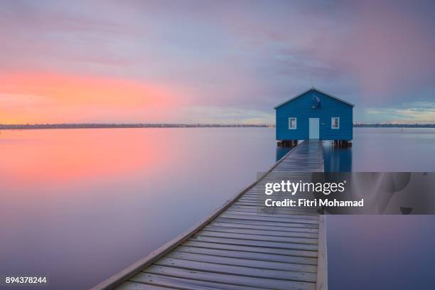 dramatic sunrise over the boathouse in the swan river in perth, western australia. - boathouse australia stock pictures, royalty-free photos & images