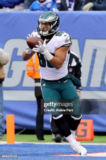 Trey Burton of the Philadelphia Eagles scores a 13 yard touchdown pass against the New York Giants in the second quarter during their game at MetLife...