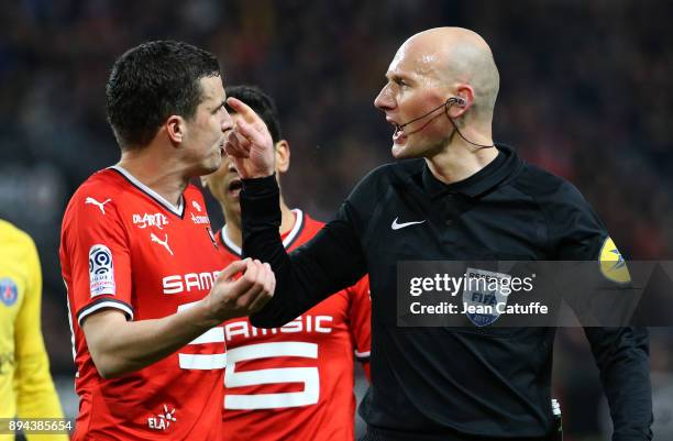 Romain Danze of Stade Rennais argues with referee Antony Gautier during the French Ligue 1 match between Stade Rennais and Paris Saint Germain at...