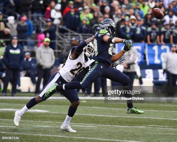 Safety Lamarcus Joyner of the Los Angeles Rams prevents wide receiver Doug Baldwin of the Seattle Seahawks from making a catch during the game at...