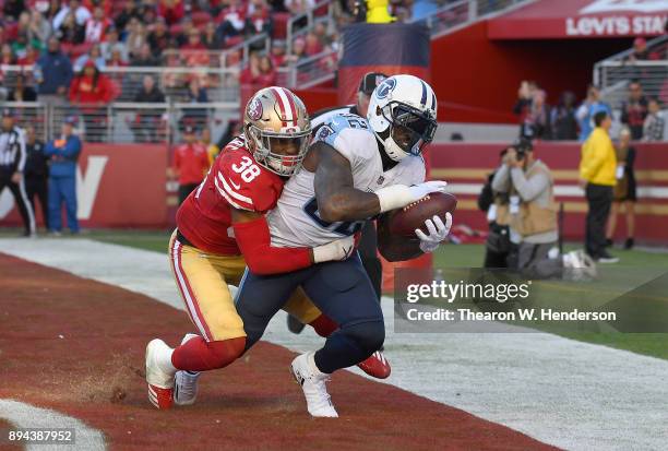 Delanie Walker of the Tennessee Titans catches a touchdown pass over Adrian Colbert of the San Francisco 49ers during their NFL football game at...