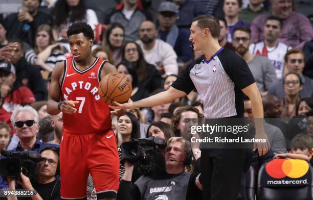 In second half action, referee JB DeRosa hands the ball on the sidelines to Toronto Raptors guard Kyle Lowry . DeRosa threw Lowry out of a game...