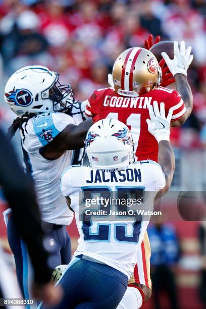 Wide receiver Marquise Goodwin of the San Francisco 49ers catches a pass in front of cornerback Adoree' Jackson of the Tennessee Titans and Erik...