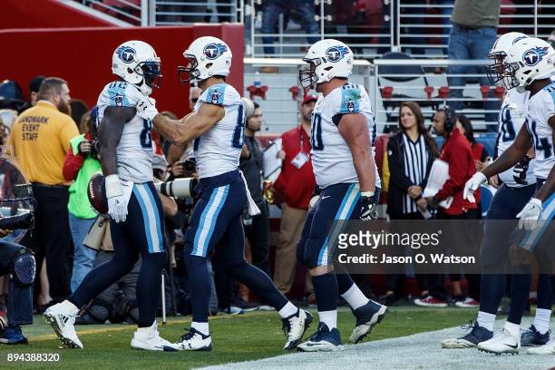 Tight end Delanie Walker of the Tennessee Titans is congratulated by teammates after scoring a touchdown against the San Francisco 49ers during the...