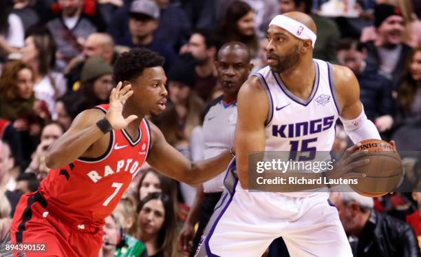 In first half action, Toronto Raptors guard Kyle Lowry guards Sacramento Kings guard Vince Carter . The Toronto Raptors took on the Sacramento Kings...