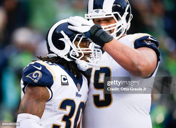 Running back Todd Gurley of the Los Angeles Rams is greeted by Rob Havenstein in the third quarter after scoring another touchdown against the...