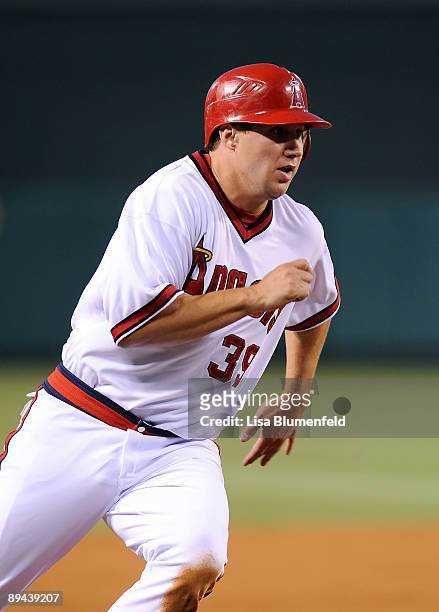 Robb Quinlan of the Los Angeles Angels of Anaheim runs home to score in the third inning against the Cleveland Indians on July 28, 2009 in Anaheim,...