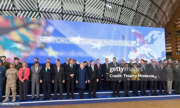 Leaders pose for a ceremony on the Permanent Structure Cooperation on the margin of an European Council in the Europa, the EU Council headquarter, on...