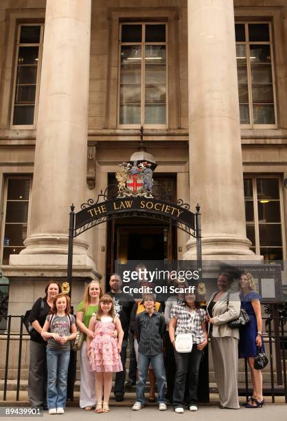 Families with children suffering from birth defects pose for photographs outside the Law Society following a ruling that Corby Council have been...