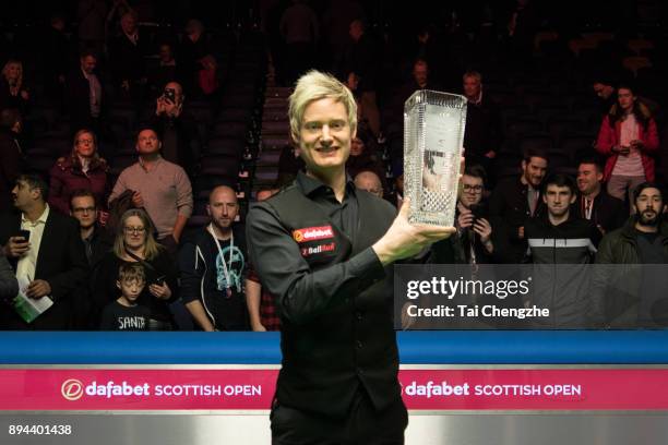 Neil Robertson of Australia poses with his trophy after winning the final match against Cao Yupeng of China on day seven of the 2017 Scottish Open at...