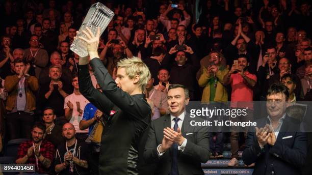 Neil Robertson of Australia poses with his trophy after winning the final match against Cao Yupeng of China on day seven of the 2017 Scottish Open at...