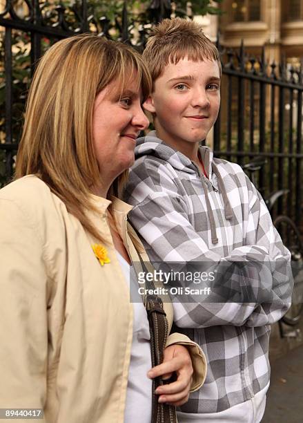 Dylan South and his mother Audrey Barfield pose for photographs outside the High Court following a ruling that Corby Council have been found to be...