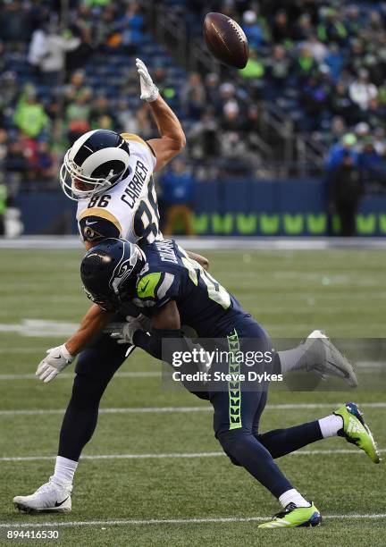 Cornerback Justin Coleman of the Seattle Seahawks breaks up a pass intended for tight end Derek Carrier of the Los Angeles Rams during the fourth...