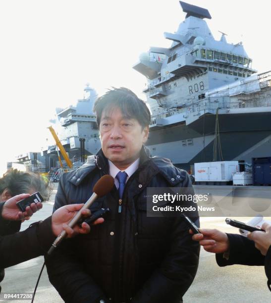 Japanese Defense Minister Itsunori Onodera speaks to the press after visiting British aircraft carrier HMS Queen Elizabeth in Portsmouth in...