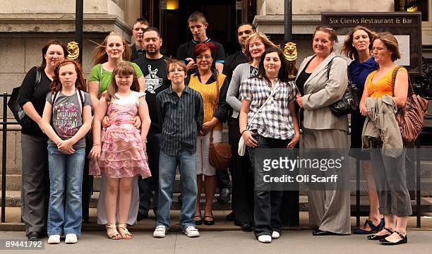 Families with children suffering from birth defects pose for photographs outside the Law Society following a ruling that Corby Council have been...