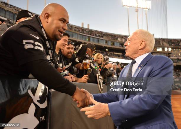 Dallas Cowboys owner Jerry Jones greets fans in the stands prior to their game against the Oakland Raiders during their NFL game at Oakland-Alameda...