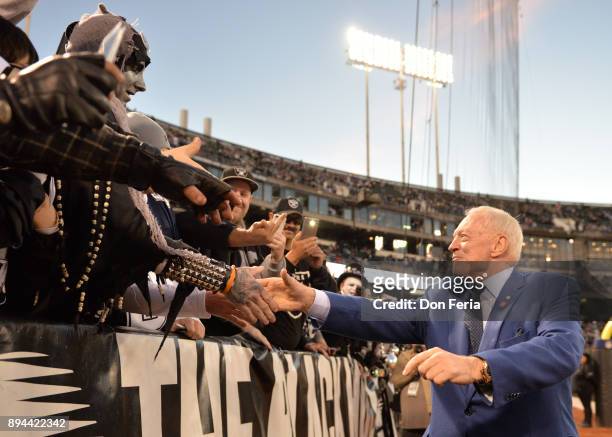 Dallas Cowboys owner Jerry Jones greets fans in the stands prior to their game against the Oakland Raiders during their NFL game at Oakland-Alameda...