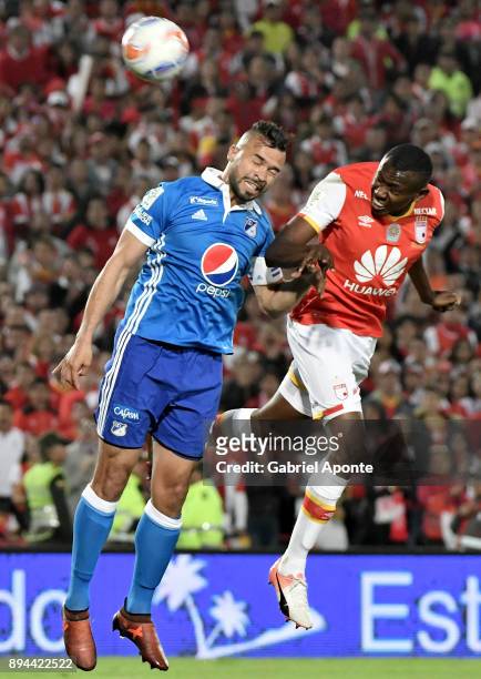 Hector Urrego of Santa Fe goes for a header with Andres Cadavid of Millonarios during the second leg match between Millonarios and Santa Fe as part...