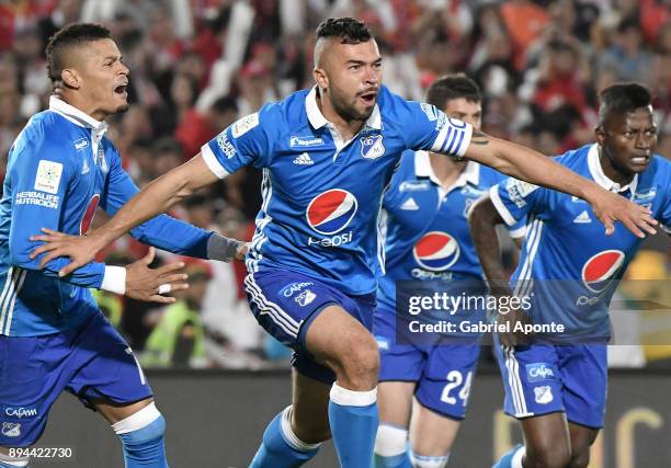 Andres Cadavid of Millonarios celebrates with teammates after scoring the first goal of his team during the second leg match between Millonarios and...