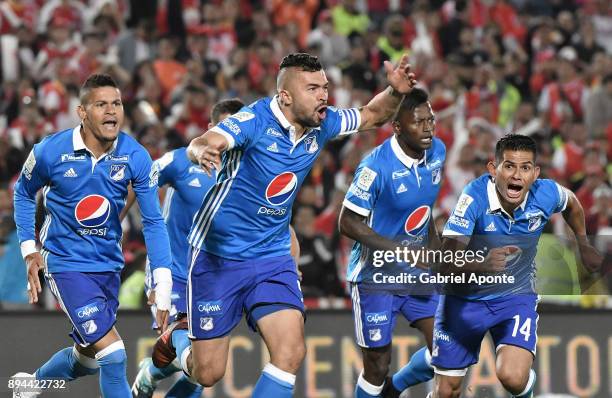 Andres Cadavid of Millonarios celebrates with teammates after scoring the first goal of his team during the second leg match between Millonarios and...