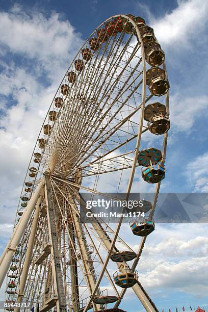 carousel again blue sky in a amusement park - side show stock pictures, royalty-free photos & images