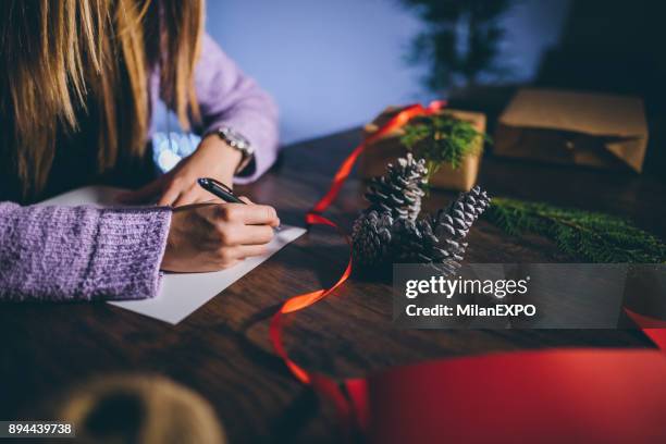 writing a christmas card - christmas list stock pictures, royalty-free photos & images