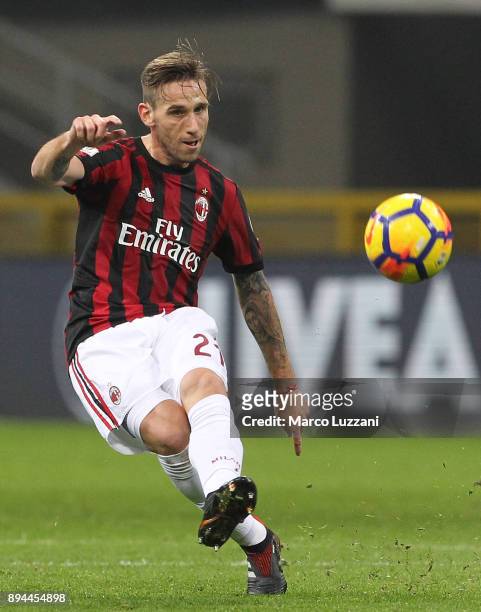 Lucas Biglia of AC Milan in action during the Tim Cup match between AC Milan and Hellas Verona FC at Stadio Giuseppe Meazza on December 13, 2017 in...