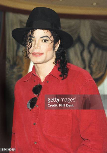 Michael Jackson poses at a press conference before a date on his HIStory world tour in 1996.