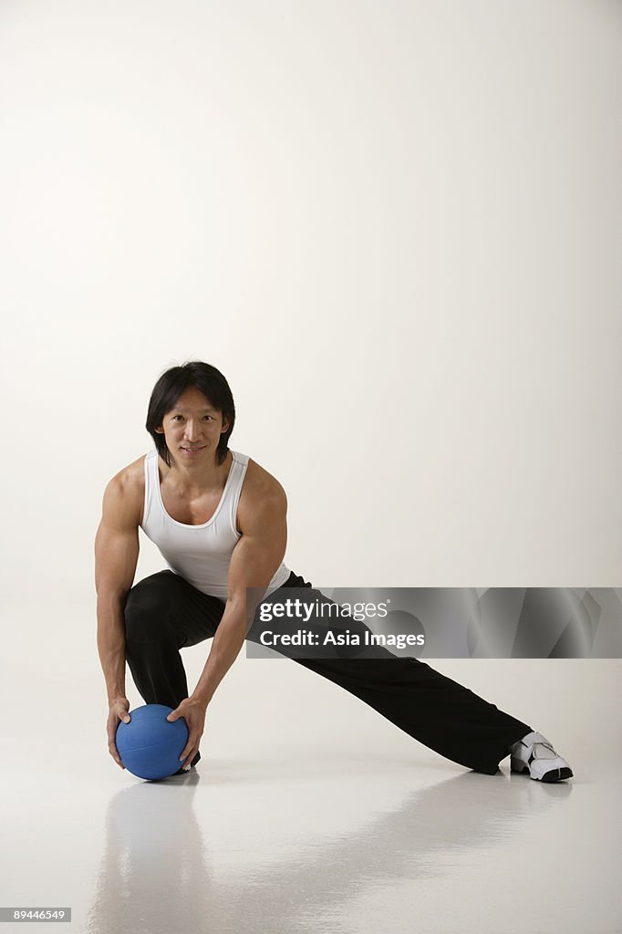 Man working out with medicine ball